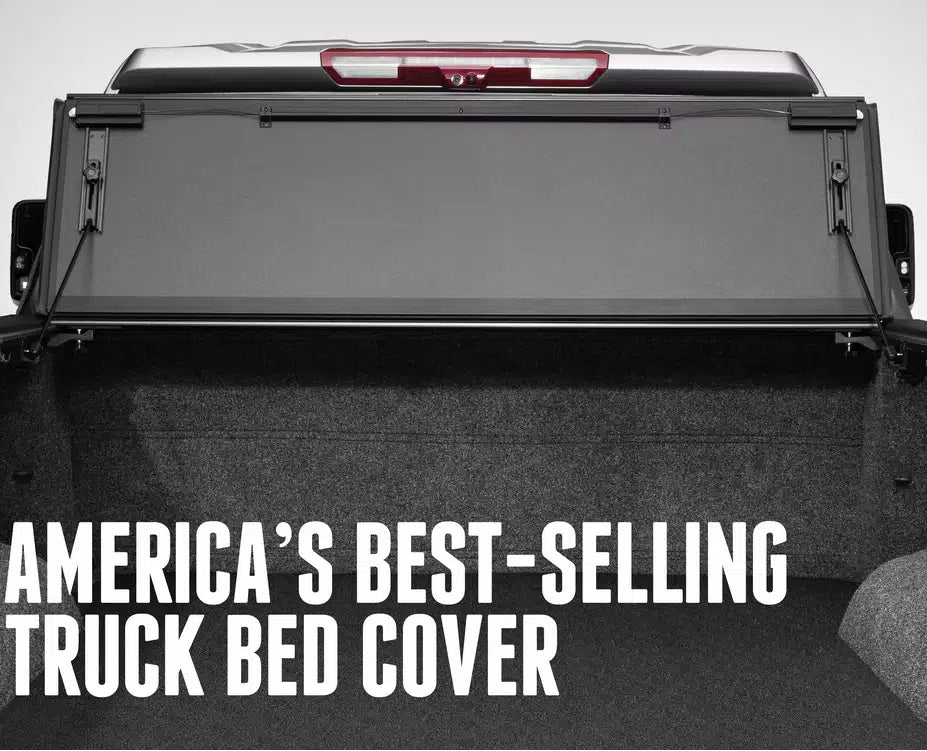 A black retractable BAK MX4 (GEN3) truck tonneau cover shown installed in the bed of a pickup truck, with large white text reading 'AMERICA'S BEST-SELLING TRUCK BED COVER' across the lower portion.