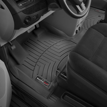 WeatherTech Dodge Caravan 1st row Over The Hump 1st row black floor mats