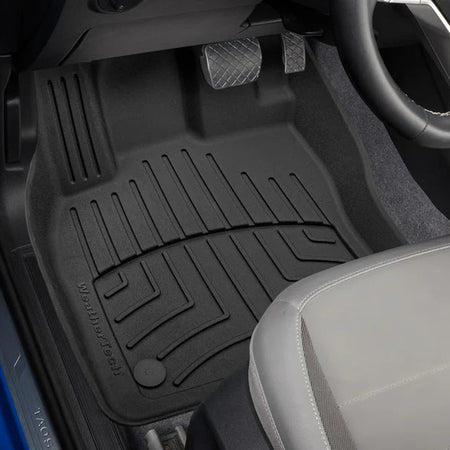 Custom Fit High Performance Black VW Taos 1st row floor liner in vehicle