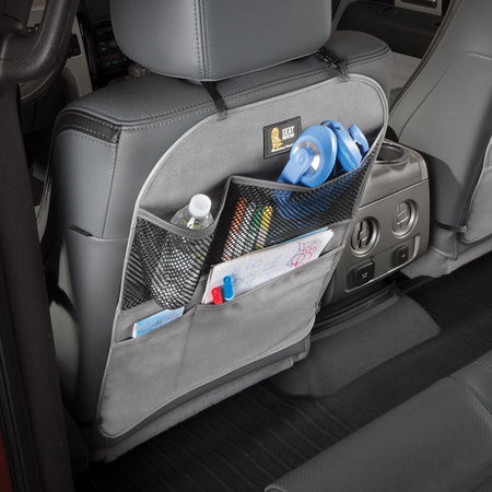 The WeatherTech Seat Back Protector in light grey, with storage for water bottles, headphones and childrens in car items.